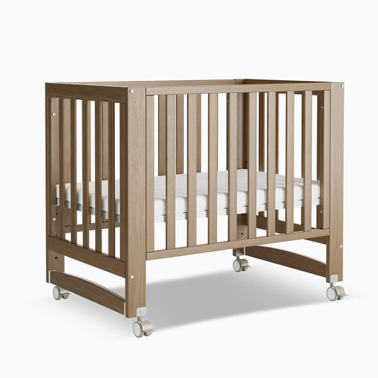 EvoNest Baby Crib, 6 in 1 Convertible Mini Crib with Wheels, 100% New Zealand Wood Growing Bed, 4 Adjustable Mattress Height，Walnut Brown