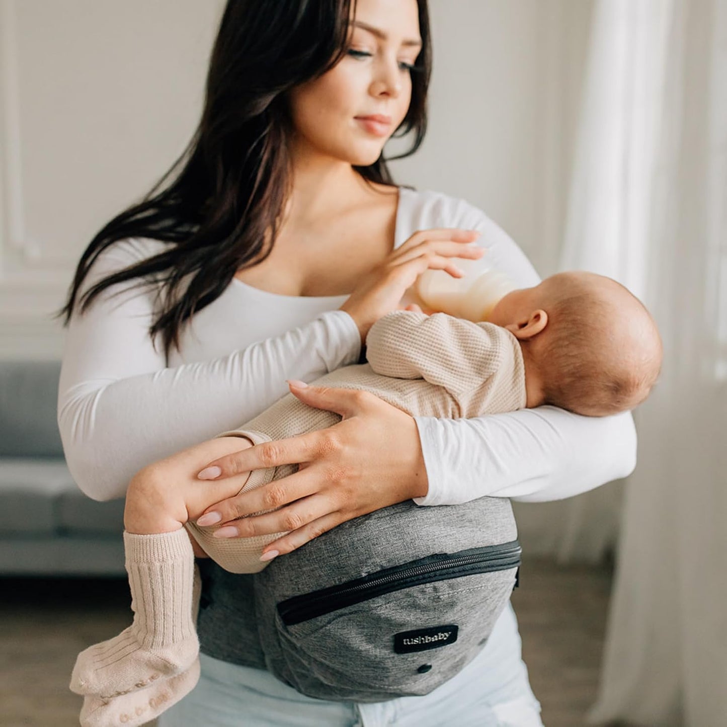Tushbaby Ergonomic Hip Seat Carrier- for Babies and Toddlers 0-3yrs, Safety Approved, Structured Support, Convenient Pockets, Feeding Aid, Durable YKK Zippers, Foam-Free Build, (Grey)